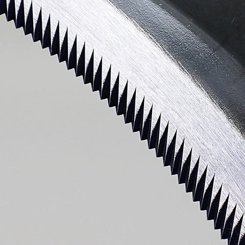 Close-up of serrated edge on Go-To 6.7 Inch Japanese Serrated Garden Sickle With Razor Sharp Carbon Steel Blade For Harvesting And Weeding