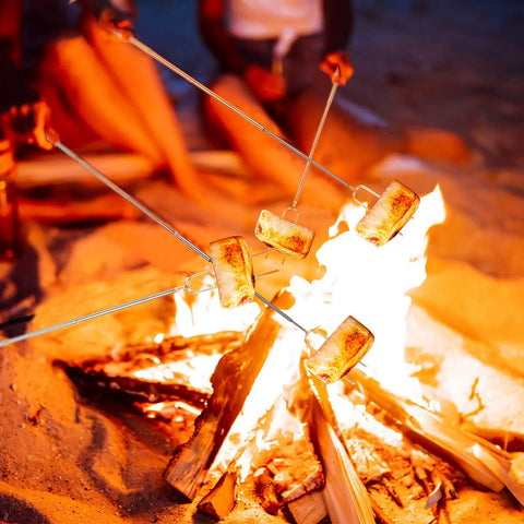 32 Inch Telescoping Marshmallow Roasting Sticks Set For Campfire Open Fire Pit S'mores Skewers Perfect For Roasting Marshmallows, Hot Dogs, And Sausages, 5 Pack With Bright Color Tips For Easy Grilling And Campout Vibes All Night at a campfire.