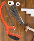 Built Tough Portable Mini Hacksaw Featuring Thickened Carbon Steel Blade And Ten Spare Replacements For Effortless Wood And Metal Cutting Around The Garage Or Job Site Ideal For Home Improvement And Professional Contractors on wooden surface with replacement blades.