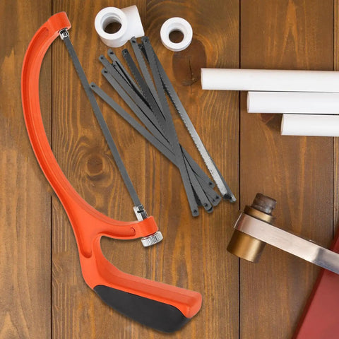 Built Tough Portable Mini Hacksaw Featuring Thickened Carbon Steel Blade And Ten Spare Replacements For Effortless Wood And Metal Cutting Around The Garage Or Job Site Ideal For Home Improvement And Professional Contractors on wooden surface with replacement blades.