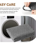 Dope Shredded Memory Foam Travel Pillow with removable cover next to washing machine, ideal for camping and backpacking.