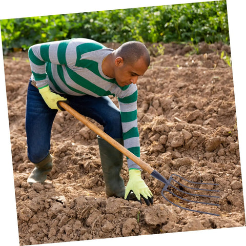 Man using Handheld Manure Fork For Quick Efficient Farm Cleanup And Grass Yard Work No Fuss Multi-Function Iron Pitchfork