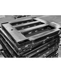 Stack of steel platforms for Rock Solid 36 By 36 Platform Scale 5000 Pound Capacity Featuring Dead On Digital Readout used in warehouses.