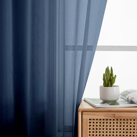 Pure Sheer Window Curtains 72 Inch Long 2 Panels Navy Blue Voile Drapes by a window with a wooden table.
