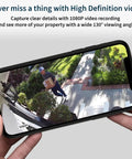 Hand holding smartphone displaying footage from Essential Wireless Security Camera With 1080p HD Video, Color Night Vision.