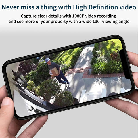 Hand holding smartphone displaying footage from Essential Wireless Security Camera With 1080p HD Video, Color Night Vision.