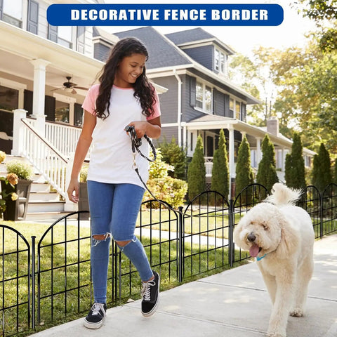 26 Pack Decorative Garden Fence 22 Inch By 28 Foot Arched No Dig Border Fence installed in front of a house with dog and person walking