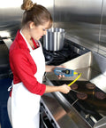 Person using Durable DuraNeedle Type K Insertion Thermocouple Probe, 6 Inch Stem, on burgers in a kitchen setting.