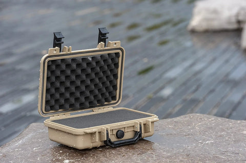 Open rugged portable all weather waterproof hard case with customizable foam for drones cameras and gear the dry case you can trust IP67 rated protection for travel storage and outdoor adventures shown on wet surface