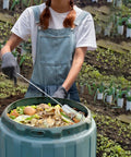 Person using Premium Compost Aerator And Turning Tool For Garden Soil Mixers, Stainless Steel Build With Ergonomic Polyamide Handle