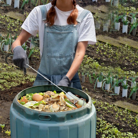 Person using Premium Compost Aerator And Turning Tool For Garden Soil Mixers, Stainless Steel Build With Ergonomic Polyamide Handle