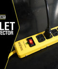 Beefy Metal Surge Protector Strip With Six Outlets And 15 Foot Yellow Cord on black surface