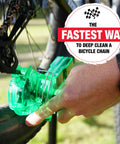 User cleaning bike chain using Pro Grade Bicycle Chain Cleaner Tool For Road Mountain Gravel And E Bikes Fast 60 Second Chain Cleaning System
