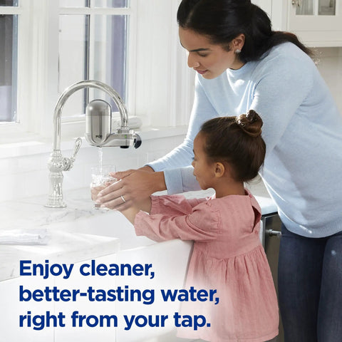 Woman and child using Lead Reducing Faucet Mount Water Filter With Easy Install, 100 Gallon Capacity, Stainless Steel Design for cleaner water