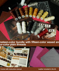 Top view of All In One Leather Working Tool Set 588Pcs Pro Gear For Beginners with thread spools, instruction manual, and leather pieces.