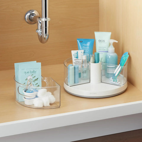 360 Degree Rotating Lazy Susan Organizer With 3 BPA Free Removable Clear Bins With Handles For Kitchen Cabinets Pantry And Bathroom Storage See It All And Grab What You Need Fast, shown under a sink with toiletries and cotton balls.