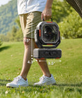 Person carrying Portable Camping Fan With 20000mAh Battery Remote And Led Lantern Stepless Speed Control And Fast Charging, outdoors