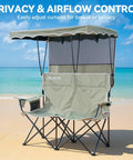 Double Camping Chair With Shade Canopy For Two People Folding Beach Chair on sandy beach with ocean backdrop