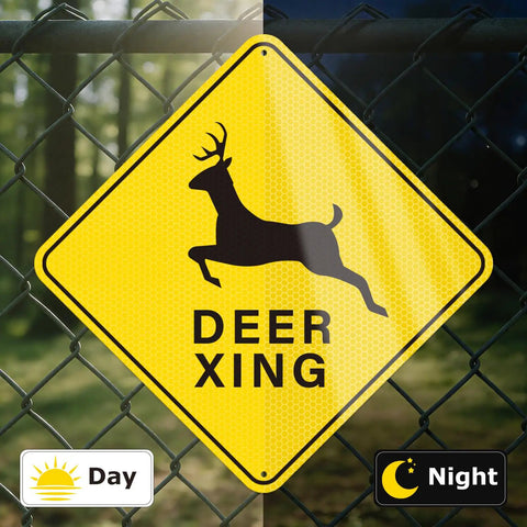 Deer Xing Crossing Sign 12x12, 2 Pack, Engineer Grade Reflective Aluminum, Built Tough Weather Resistant High Visibility Safety Sign for Driveways, Rural Roads, and Deer Rich Areas. Yellow deer crossing sign on chain-link fence, day and night