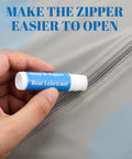 Hand applying Six Pack Zip Lubricant Wax For Smooth Zippers On Boats Vinyl Panels Canvas Bimini Backpacks Jackets Wetsuits Drysuits Marine Gear Maintenance For Effortless Opens, showing ease of use.