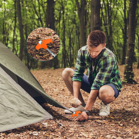 Man using 20 Pcs 12 Inch Tent Stakes Screw In Heavy Duty Ground Anchors With Hex Head Driver For Camping Garden Inflatables Metal Spikes 30 Cm