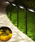 4-Pack 150 Lumen Solar Pathway Lights waterproof landscape lighting illuminating garden walkway with 12 LED beads at dusk