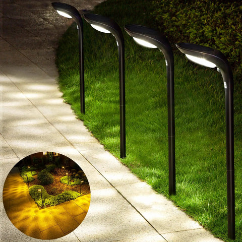 4-Pack 150 Lumen Solar Pathway Lights waterproof landscape lighting illuminating garden walkway with 12 LED beads at dusk
