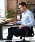 Man using Heavy Duty Under Desk Laptop Mount With Super Smooth Gliding Steel Tray for space-saving desk design.