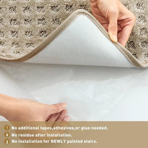Hands lifting corner of Carpet Stair Tread Landing Mat Tape Free Non Slip Doormat With Protective Rubber Back showing underside.