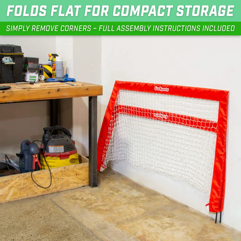 Street Hockey Set With Pop Up Goal Two Wooden Hockey Sticks With Plastic Heads And Two Street Hockey Balls, folded red goal by wall.