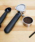 Stainless Steel Espresso And Coffee Maker Duo Brew Kit With filter holder and accessories on wooden background