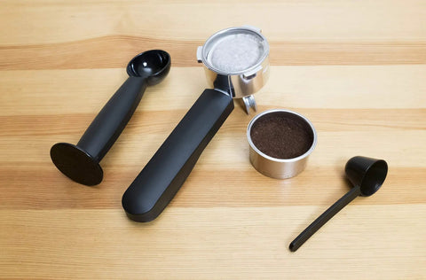 Stainless Steel Espresso And Coffee Maker Duo Brew Kit With filter holder and accessories on wooden background