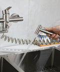Wall Mount Kitchen Faucet With Side Sprayer, Workhorse Pro Grade Commercial Faucet in brushed nickel, water flowing into sink.