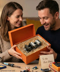 Kickass Smart Fractal Mini Bench Vise With Self Adjusting Dual Jaw Precision Clamp For Drill Press Circuit Boards Pipes And Odd Parts A Hella Useful Diy Workbench Staple in a gift box, held by a smiling couple.