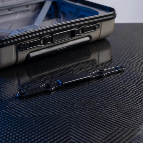 Built Tough Luggage Pull Handle Release Button Replacement For Travel Suitcases and Rolling Trolleys on black surface.