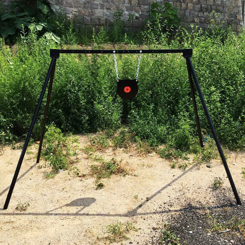 Outdoor setup of AR500 Steel Target Bullseye Gong 10 Inch Diameter 3/8 Inch Thick With Self Resetting Center Tone Spring For Pistol And Rifle Practice Pro Grade Steel Target Training.