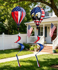 All American Patriotic Wind Spinner Duo with flag and bald eagle designs hanging in garden for 4th of July decor