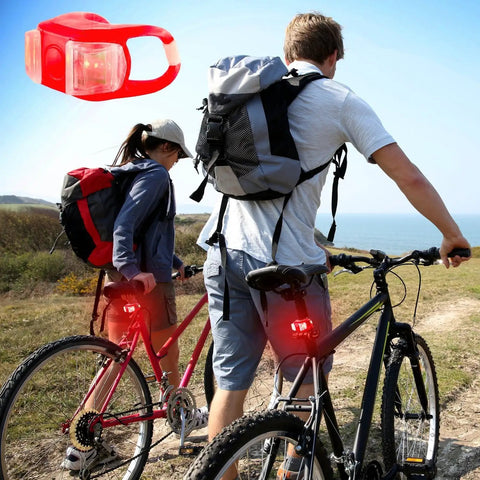 Cyclists with Two Pack Aircraft Aluminum Waterproof 300 Lumen LED Bike Light Set with headlight and taillight on trail