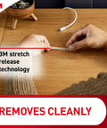 Person using Round Cord Clips For No Tool Cable Management Clear Damage Free Hanging Wall Clips pack on wooden desk.