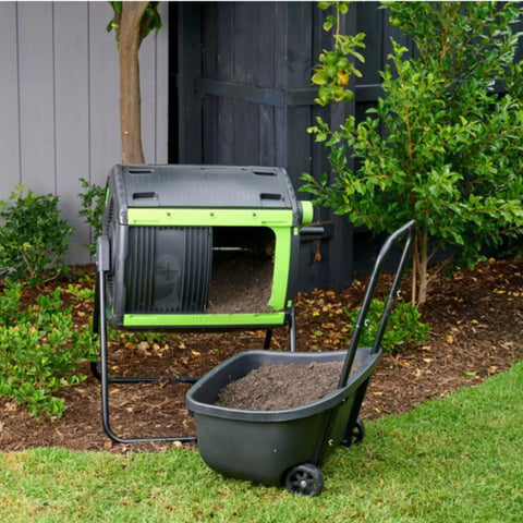 48 Gallon Compost Tumbler With Cart Dual Compartment Geared System For Easy Emptying Elevated Base With Turning Lock Ratchet placed in garden