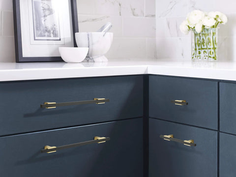 Urbanite Two Tone Brushed Gold And Matte Black Cabinet Pull For 192 Mm Center To Center Drawers And Doors in a modern kitchen.
