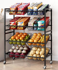 Front view of 25.2 Inch Wide Kitchen Storage Cart With Four Tier Basket System Rolling Metal Pantry Organizer Removable Baskets For Onion And Potato Storage Fruits And Veggies Black, filled with snacks and produce.