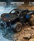 Amphibious 4WD RC Monster Truck With Waterproof Design, 1:16 Scale, splashing through water on rocky terrain.