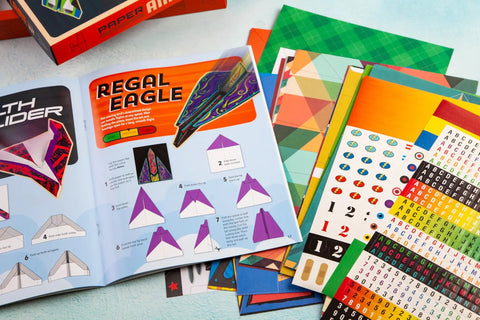 Dope Paper Plane Kit Lets You Fold Learn Fly And Build A Fleet Of 100 Paper Planes With 19 Models Colorful Sheets Custom Designs