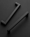 10 Pack 6-1/4 Inch Square Cabinet Handles Matte Black Drawer Pulls for Kitchen Cabinets, top view on black surface.