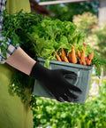 Person wearing Nitrile Coated Work Gloves with Superior Oil Resistance and Strong Grip holding vegetables in a garden
