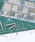 100 Pcs M6 Stainless Steel Dowel Pin Kit With 11 Sizes From M6x6mm To M6x45mm displayed on a cutting mat