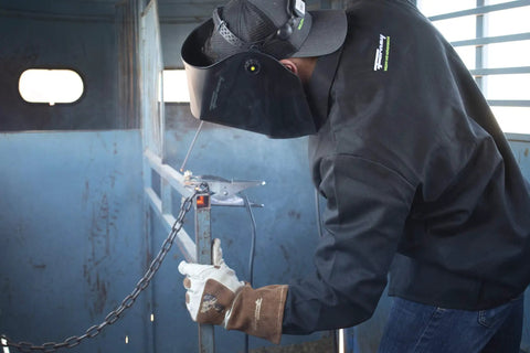 Welder using 7018 Welding Rod 3/32-Inch 5-Pound All Position Low Hydrogen Shielded Metal Arc in a fabrication project