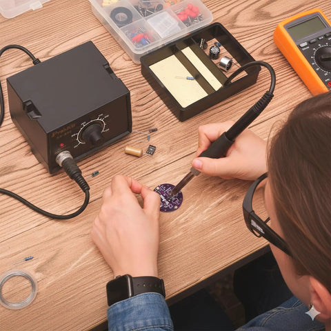 Person using Ultrasonic Levitation Soldering Kit For Beginners A Hands On STEM Electronics DIY Practice Set with tools on table
