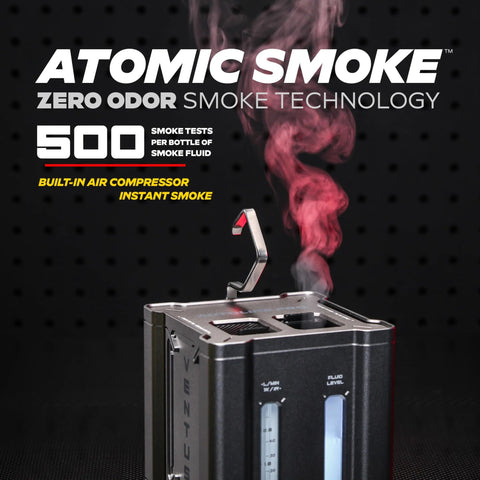 Front view of AutoLine Pro automotive smoke tester in black metal housing with blue fluid gauges.